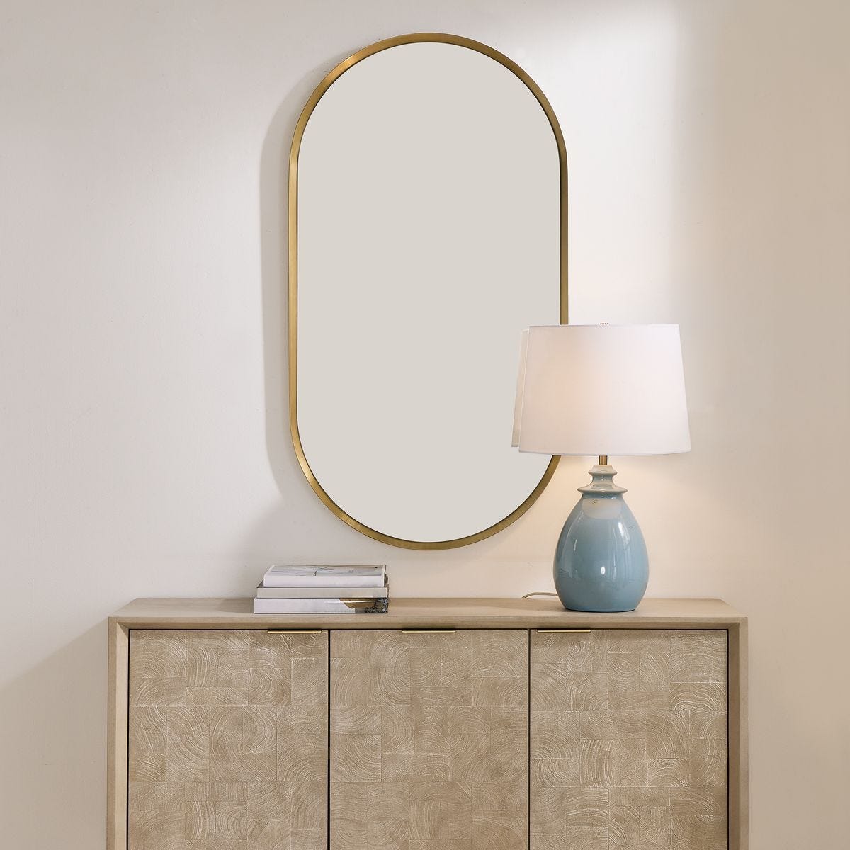 Torrado Oval Mirror, Brass - modern mirror with sleek design for contemporary interiors | Image 1 | InSTYLE Home & Rugs