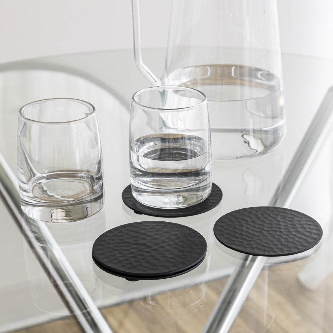 Anthology Nordic set of four hammered matte black metal coasters | InSTYLE Home & Rugs